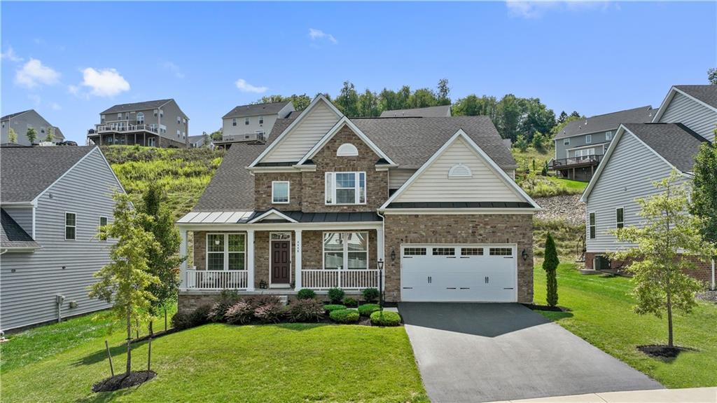 front view of a house with a yard