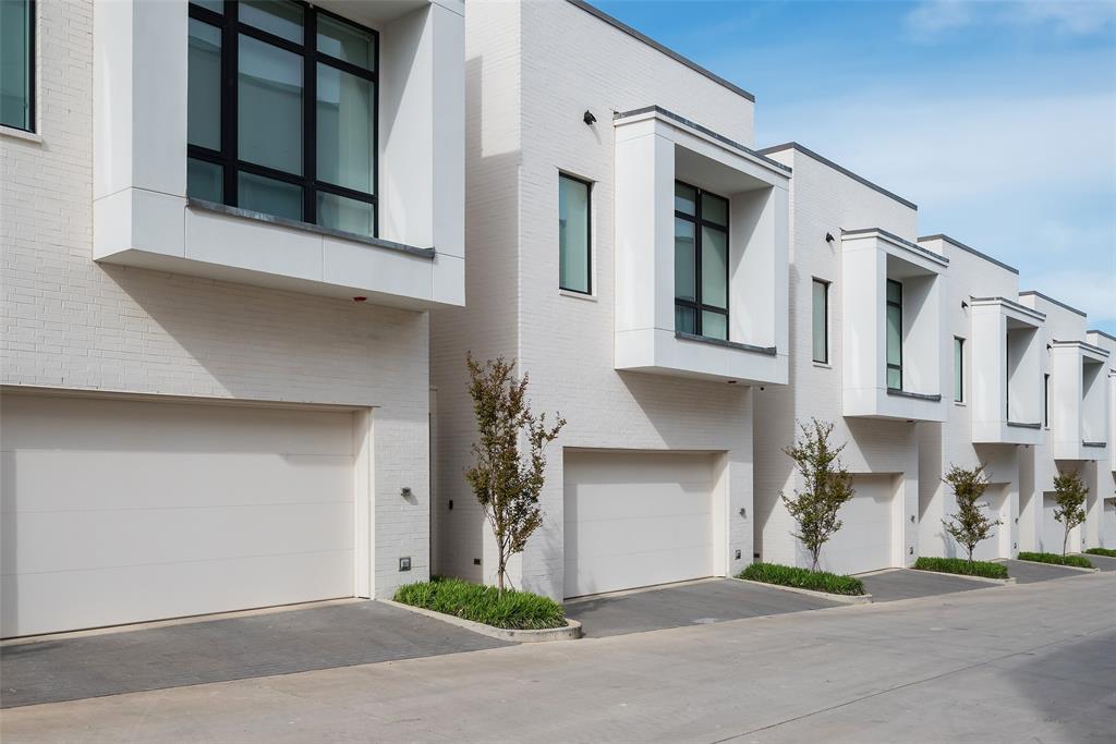 a front view of a house with garage