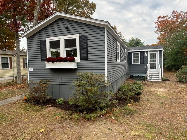 a view of house with backyard space and garden