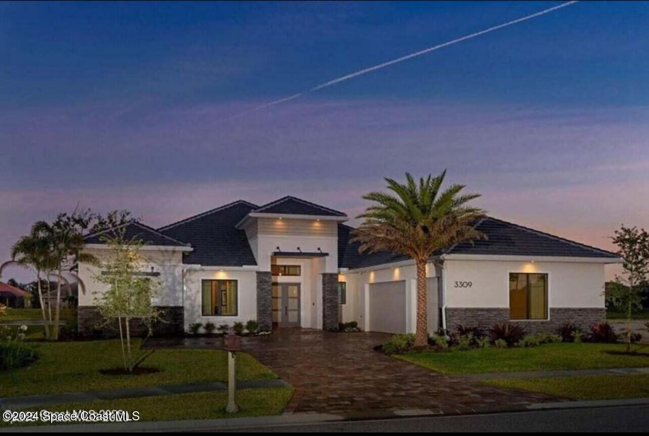 a front view of a house with a yard