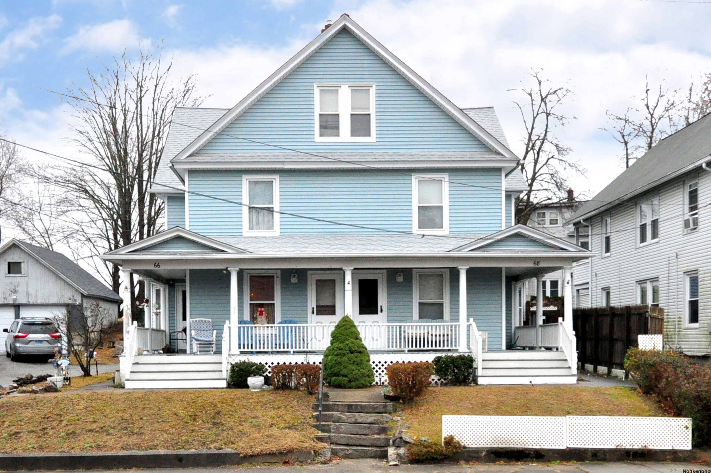 a front view of a house with garden