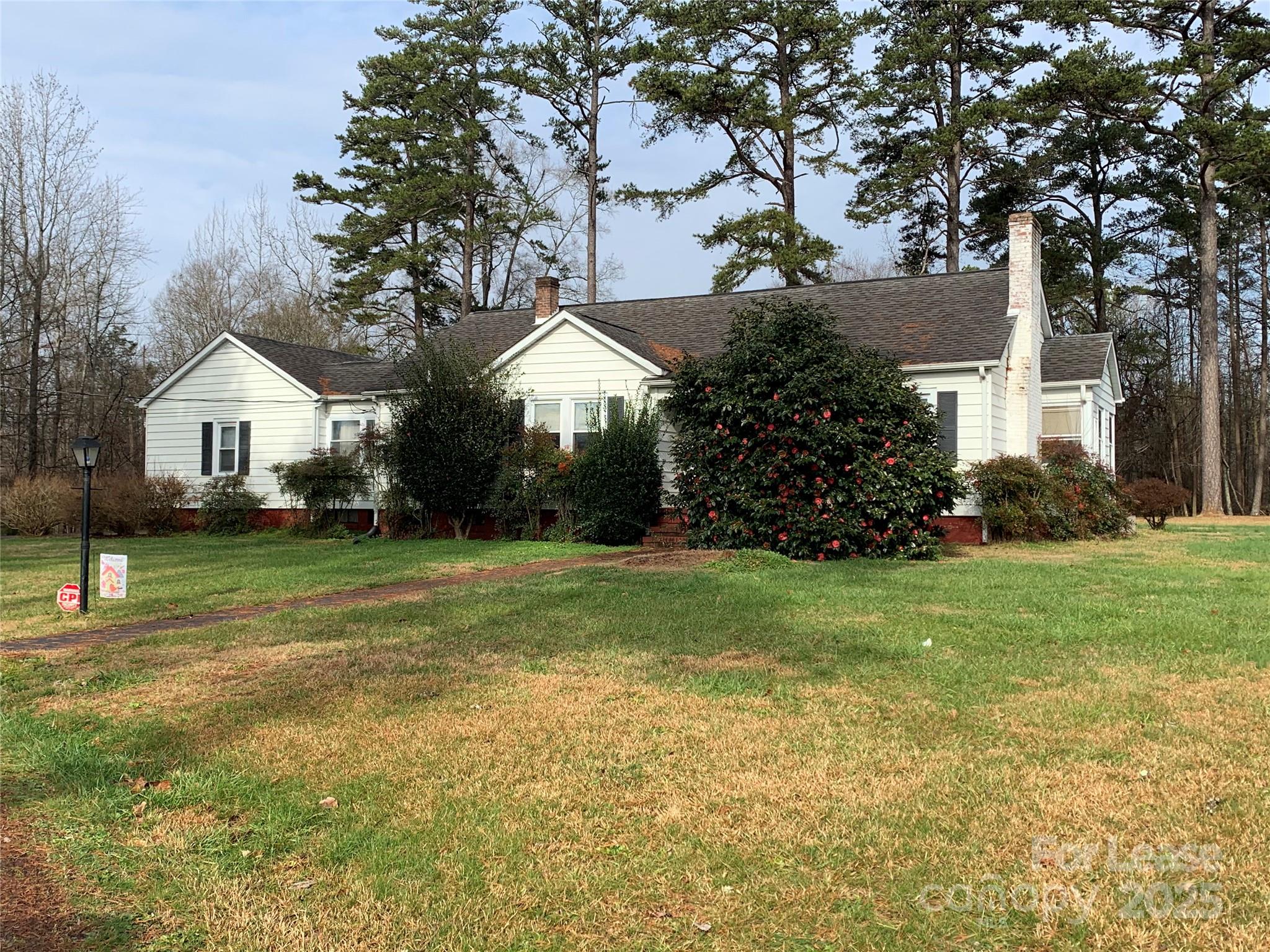 a front view of house with garden