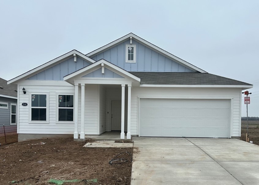 a front view of a house with garage