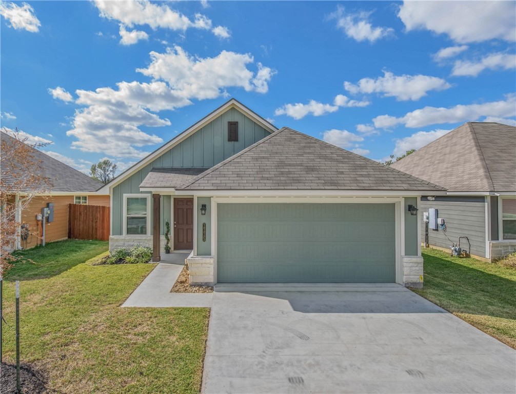 View of front of property with a garage and a fron