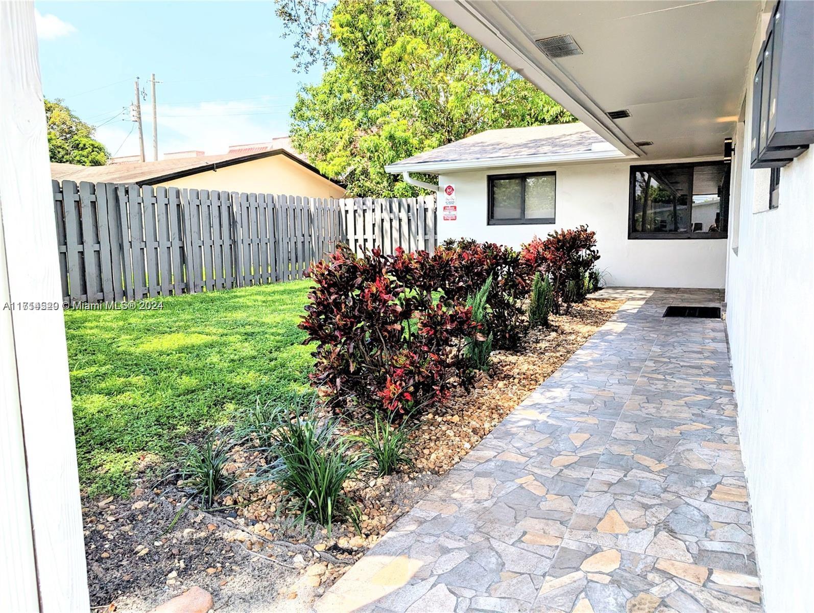 a view of a house with garden