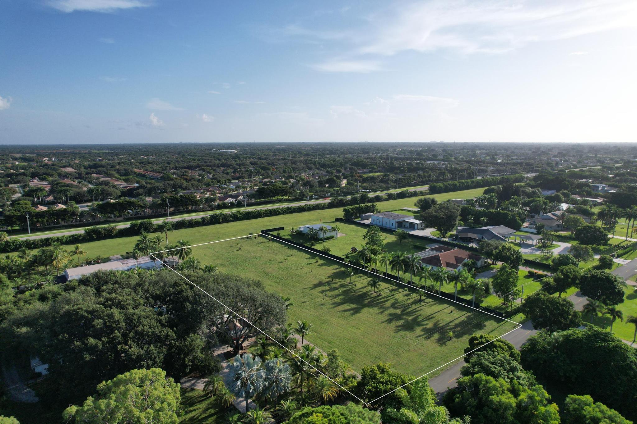 an aerial view of a houses with a yard