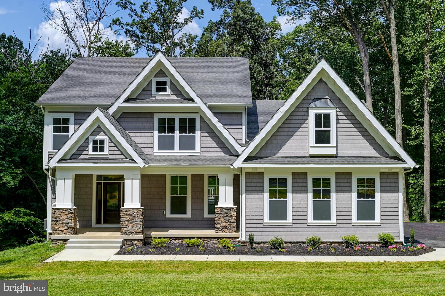 a front view of a house with yard