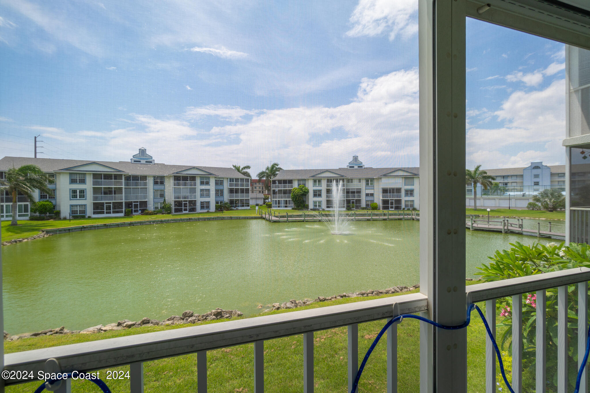 a view of a lake from a balcony