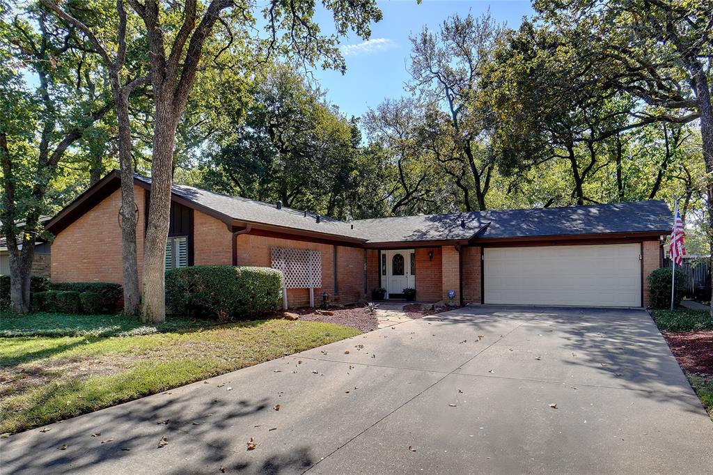 a view of a house with a yard and garage