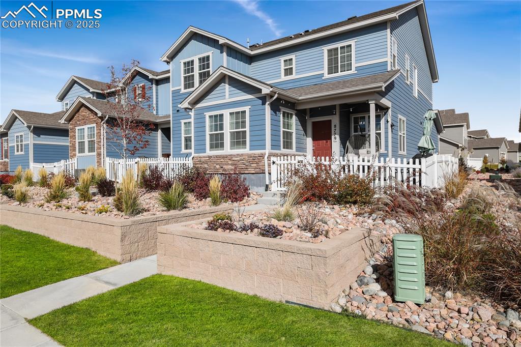 Craftsman inspired home featuring covered porch