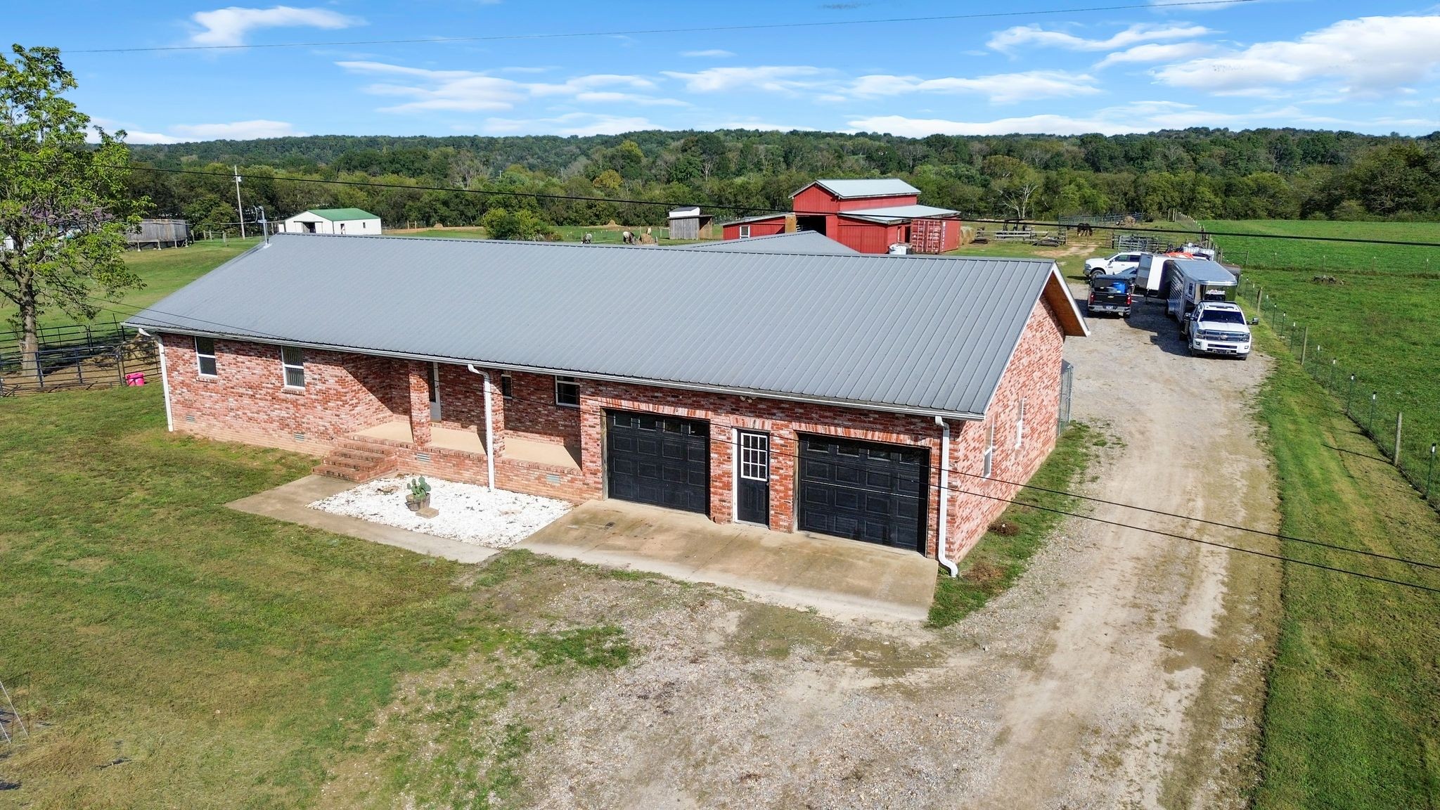 Nice Brick home with Barn and Run-in Sheds on 20 acres of Fenced and Cross Fenced River Front Property on the Duck River