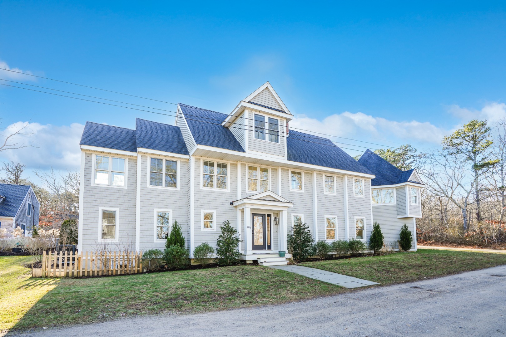 a front view of a house with a yard