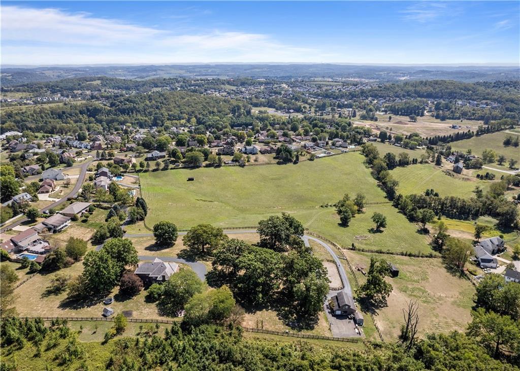 A view of the total 21.1 acres and the adjacent home and 12 acres available.