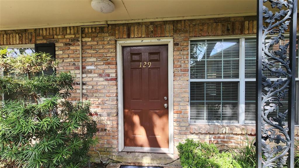 a front view of a house with a glass door