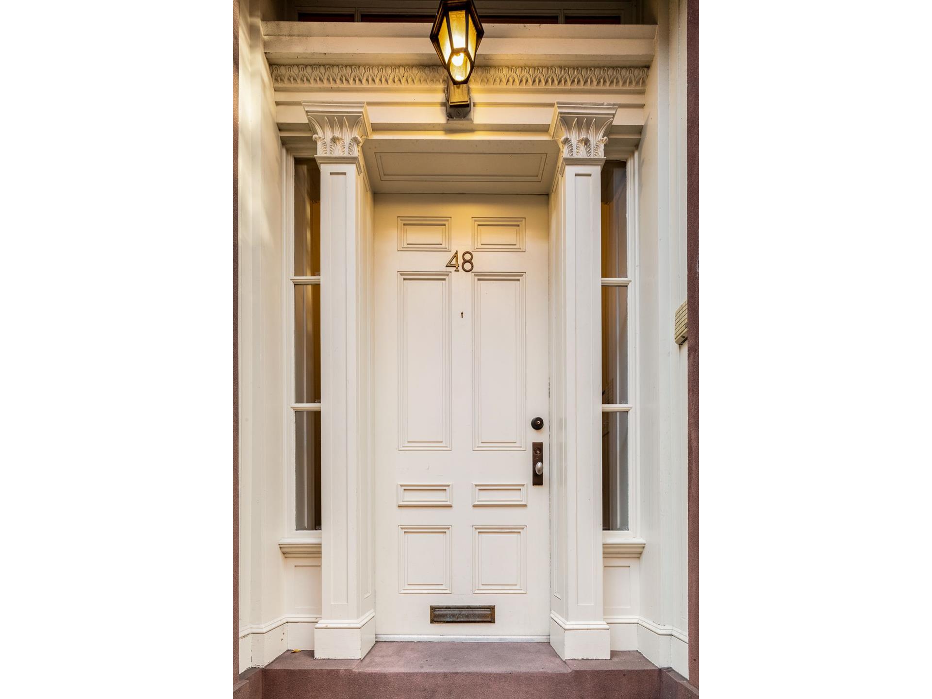 a view of a hallway with a white walls