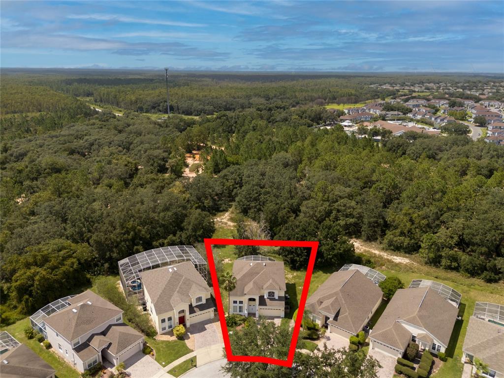 an aerial view of a houses with outdoor space