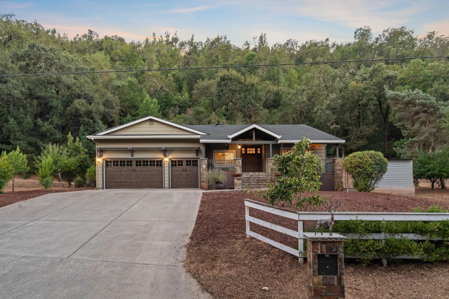 a front view of a house with trees