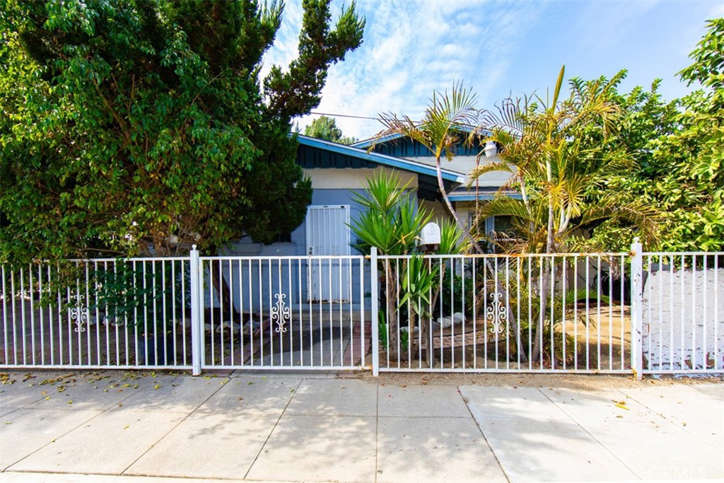 a view of a wrought iron fences in front of house