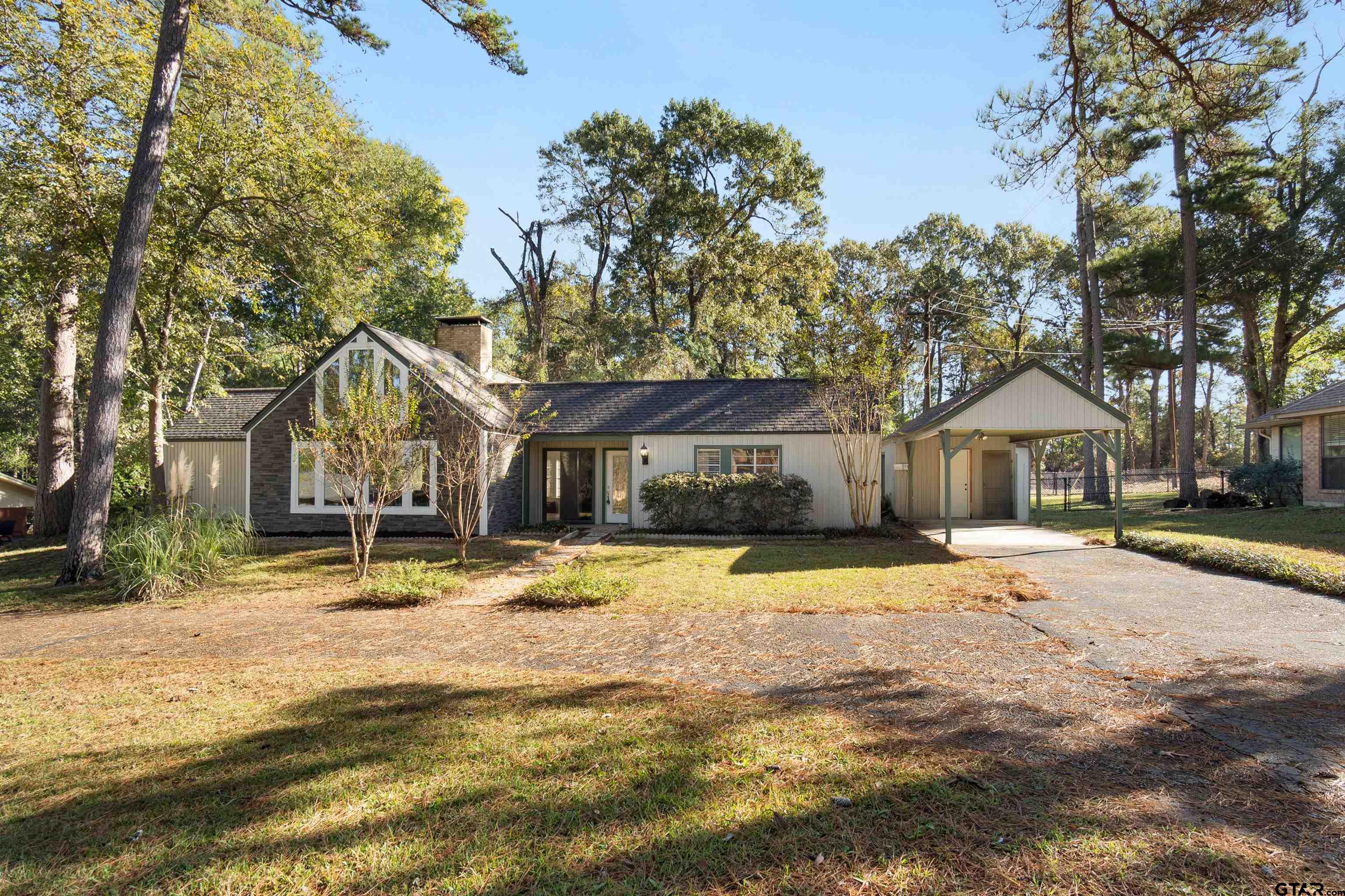 a house with trees in the background