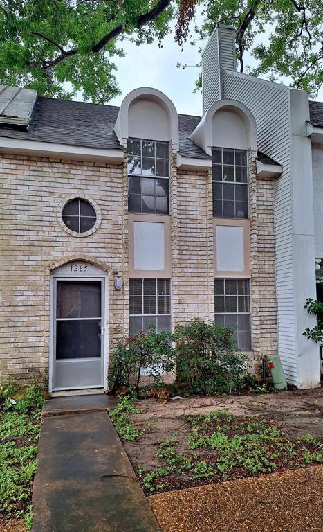 a front view of a house with yard