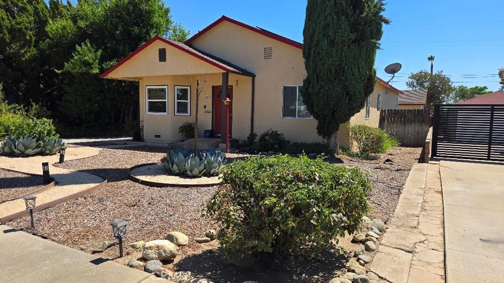 a front view of a house with garden