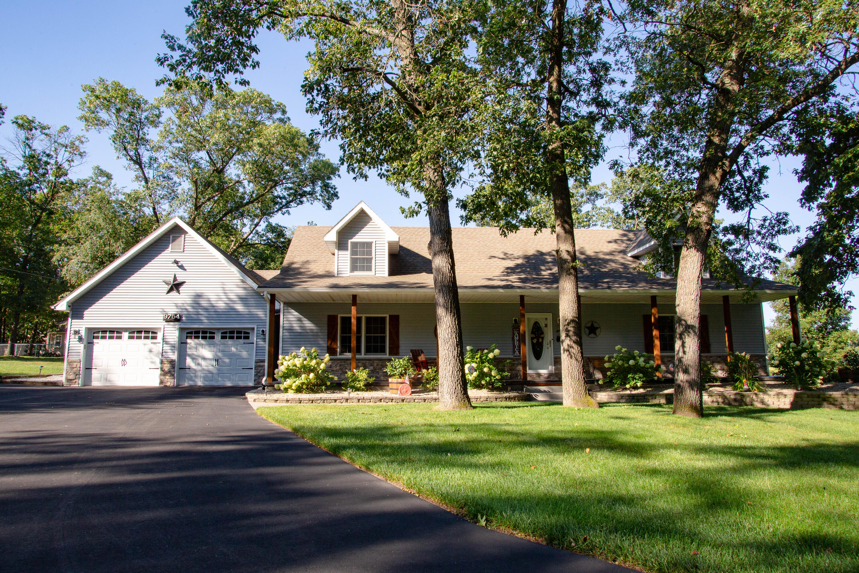 a front view of a house with a yard table and chairs