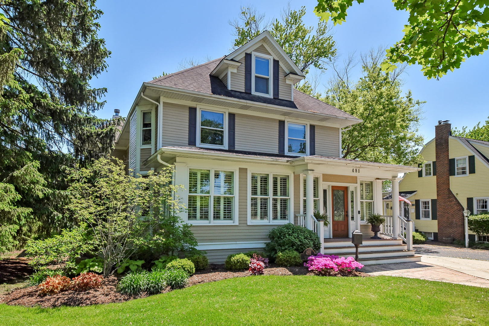 a front view of a house with a yard