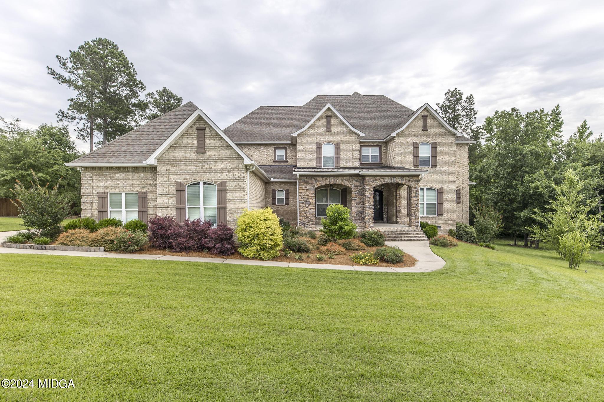 a front view of a house with a yard