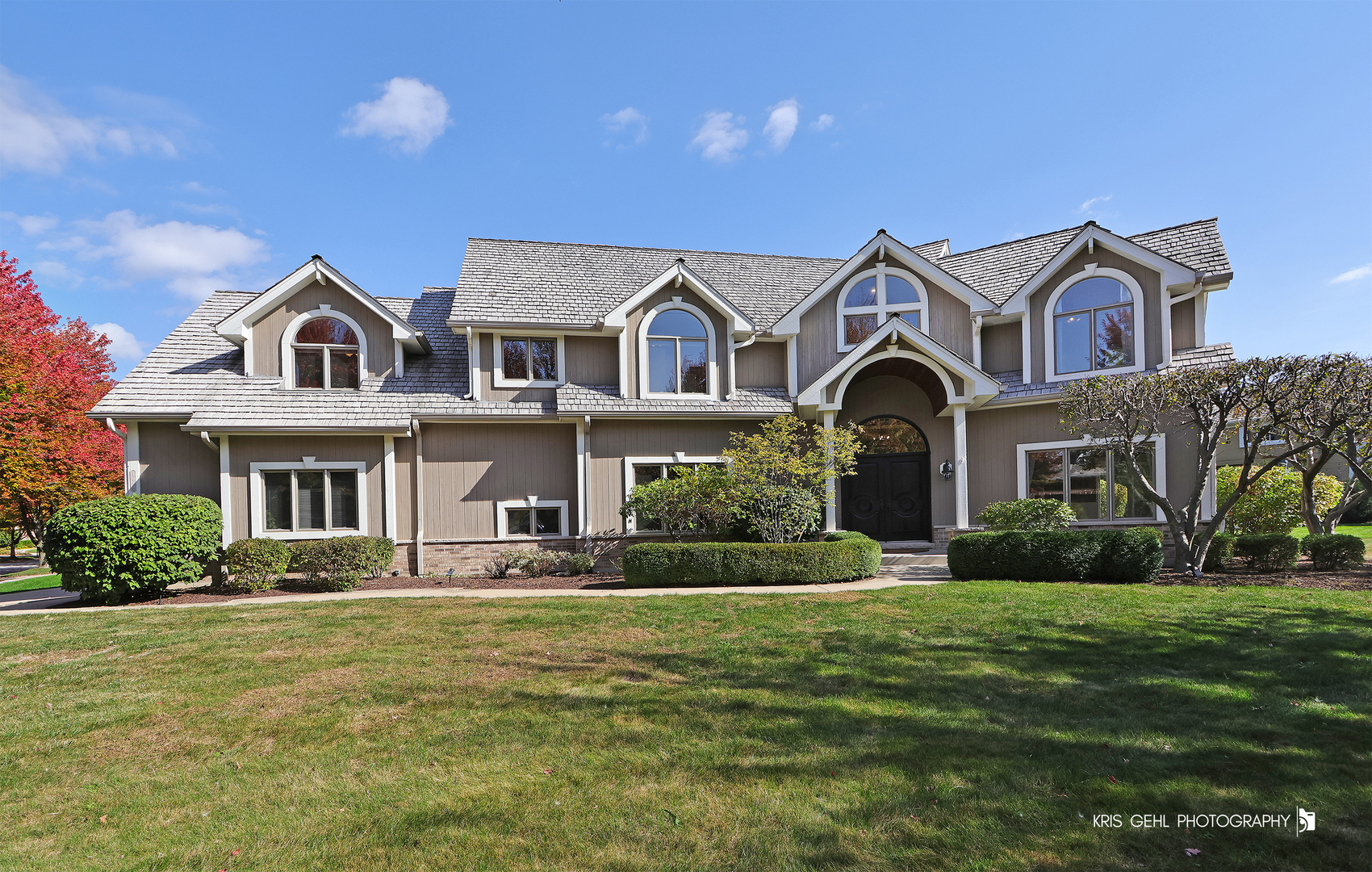 a front view of a house with a yard