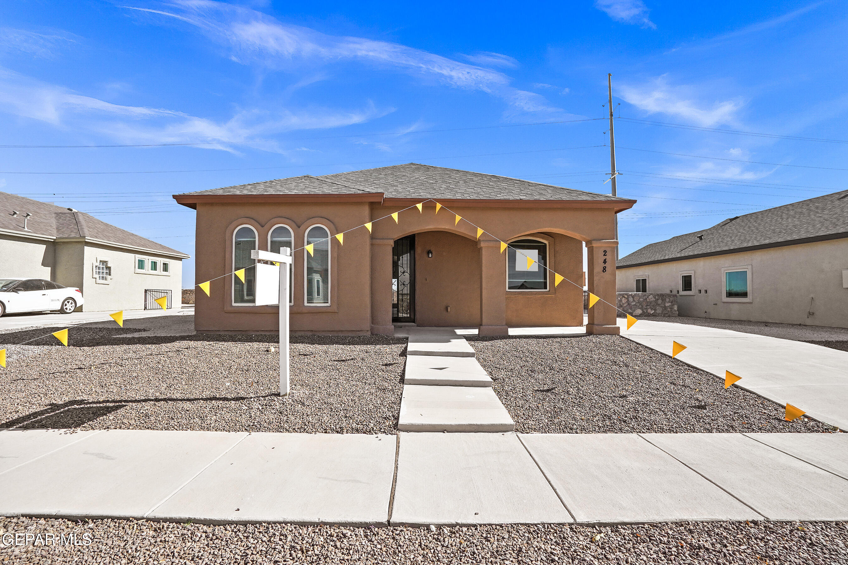 a front view of a house with a yard