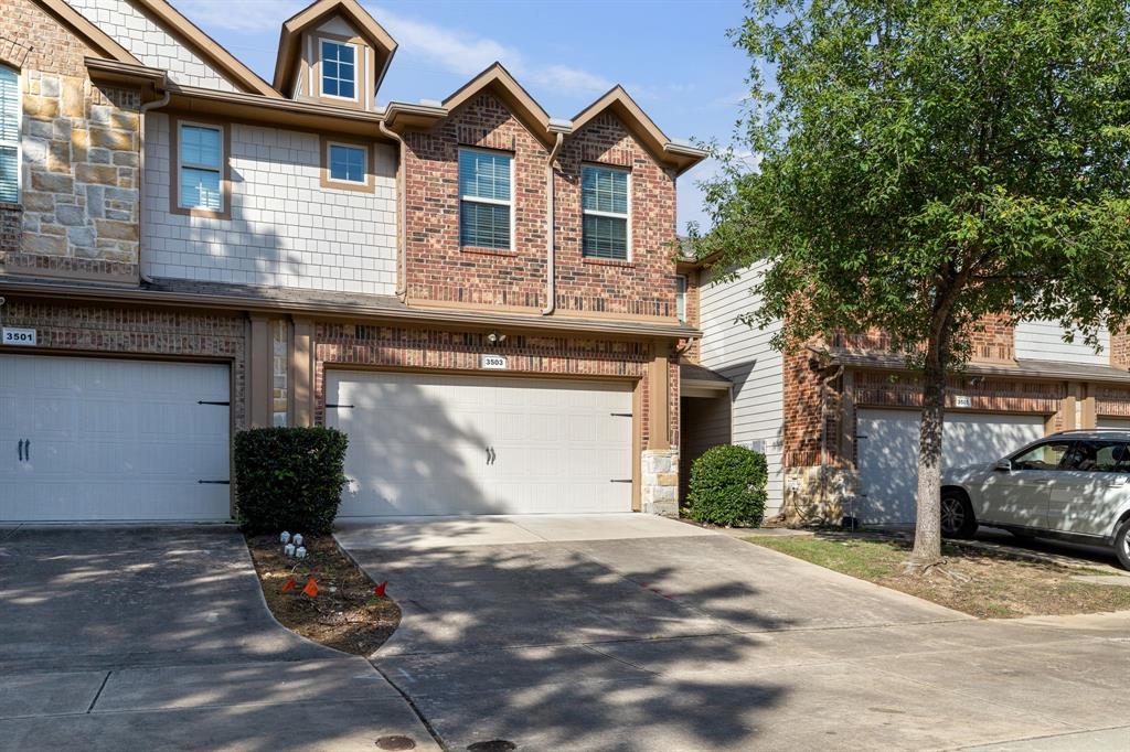 a front view of a house with parking