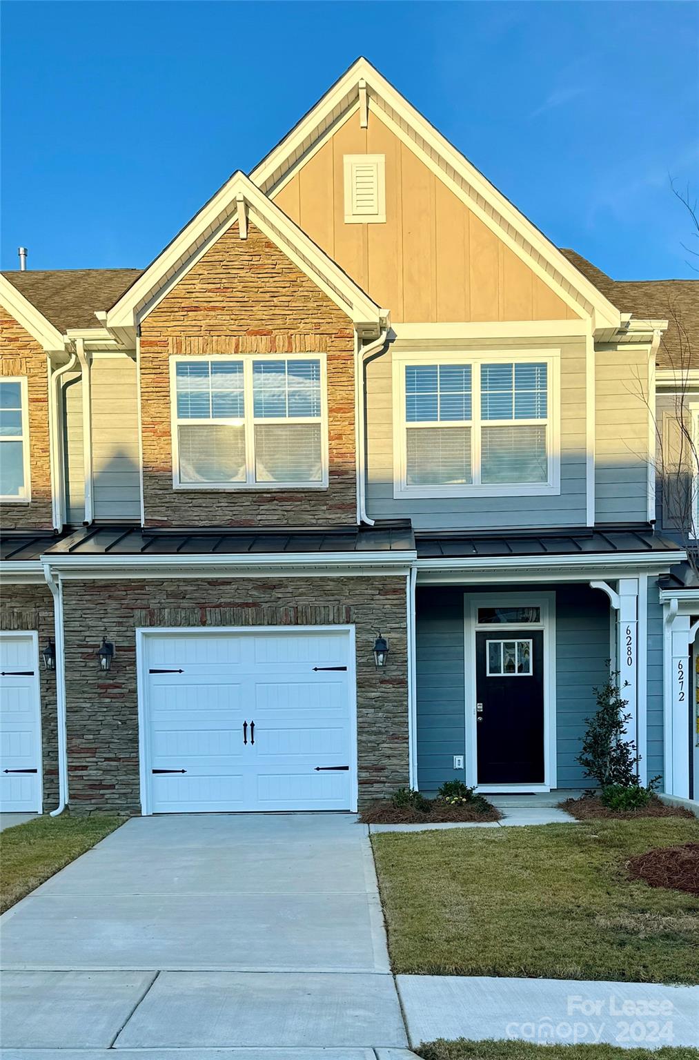 a front view of a house with a yard