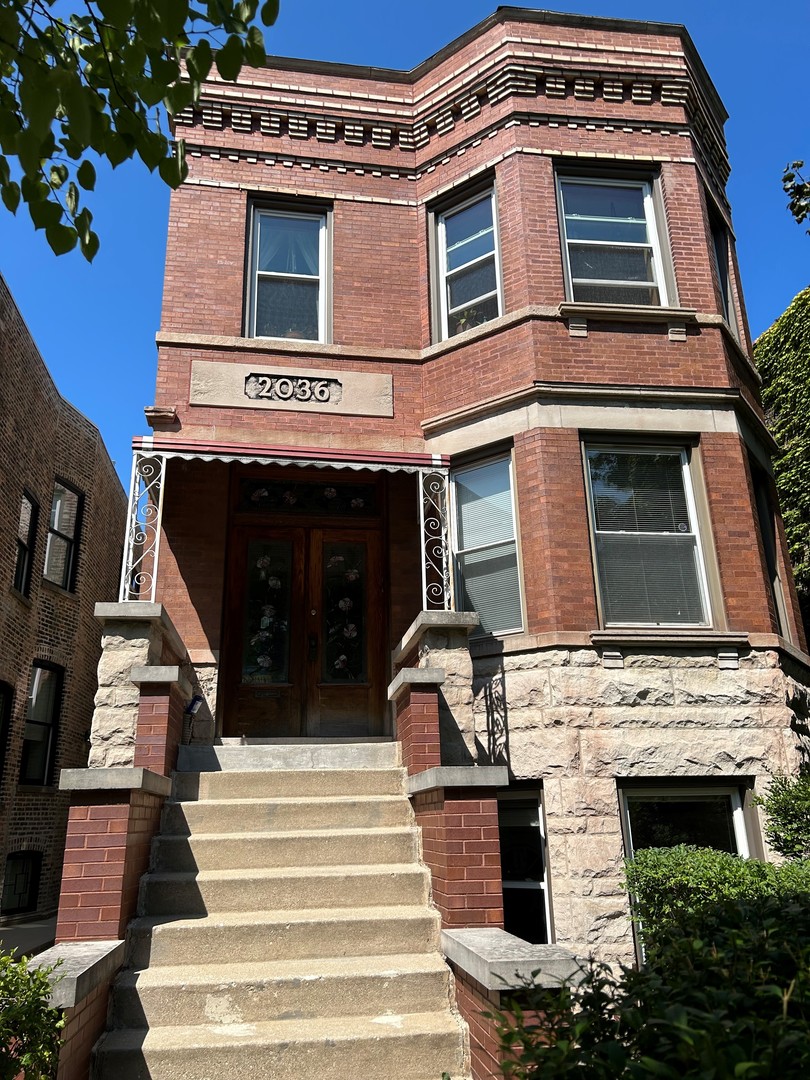 a front view of a house with stairs