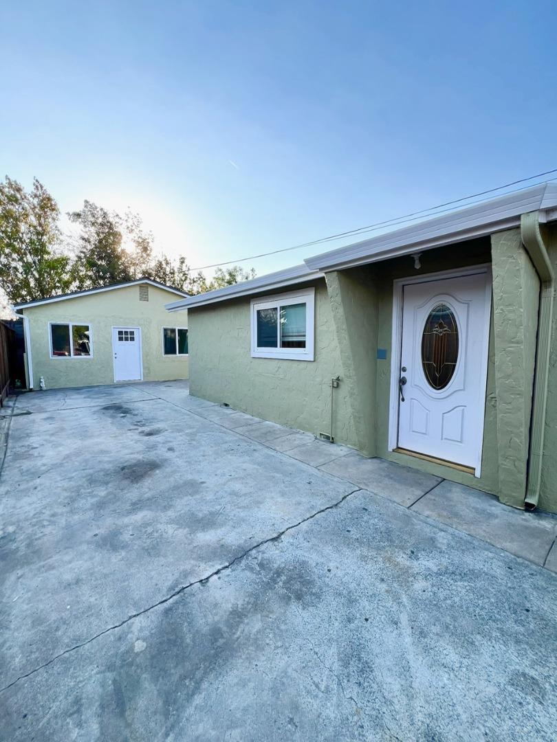 a view of a house with a yard and garage