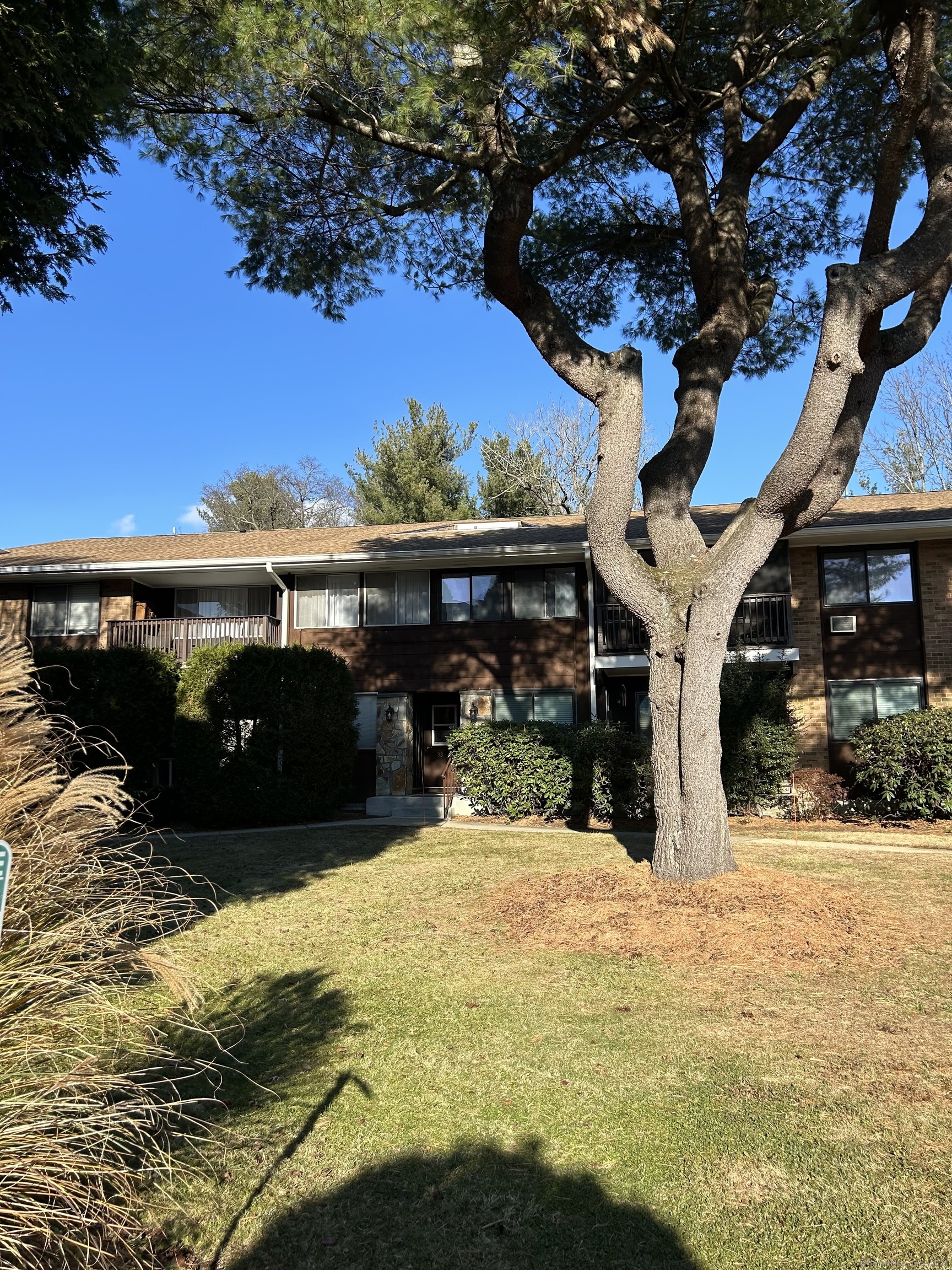 a view of a house with a yard from a balcony