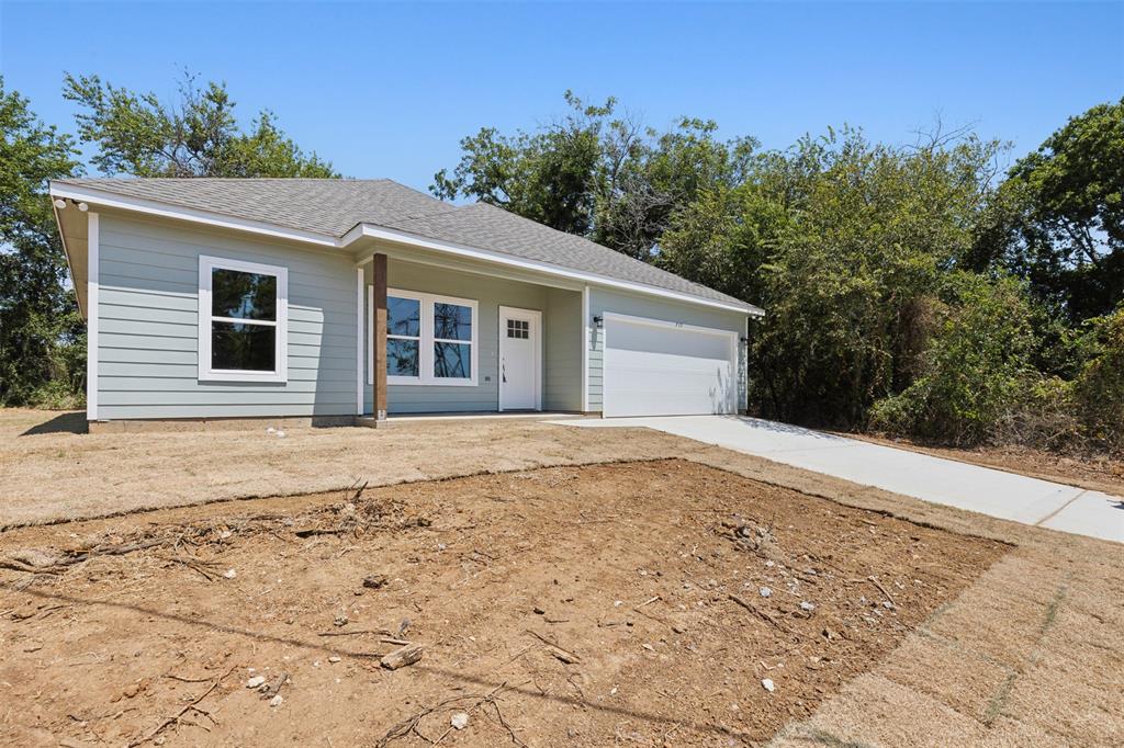 a house with trees in the background