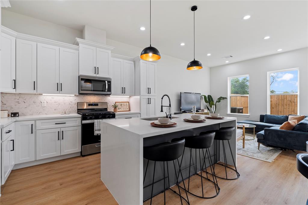 Discover seamless living in this thoughtfully designed home, where the kitchen and dining area seamlessly blend into the inviting living room. Whether you're hosting a dinner party or enjoying a quiet evening, the spacious layout provides the perfect backdrop for every occasion.