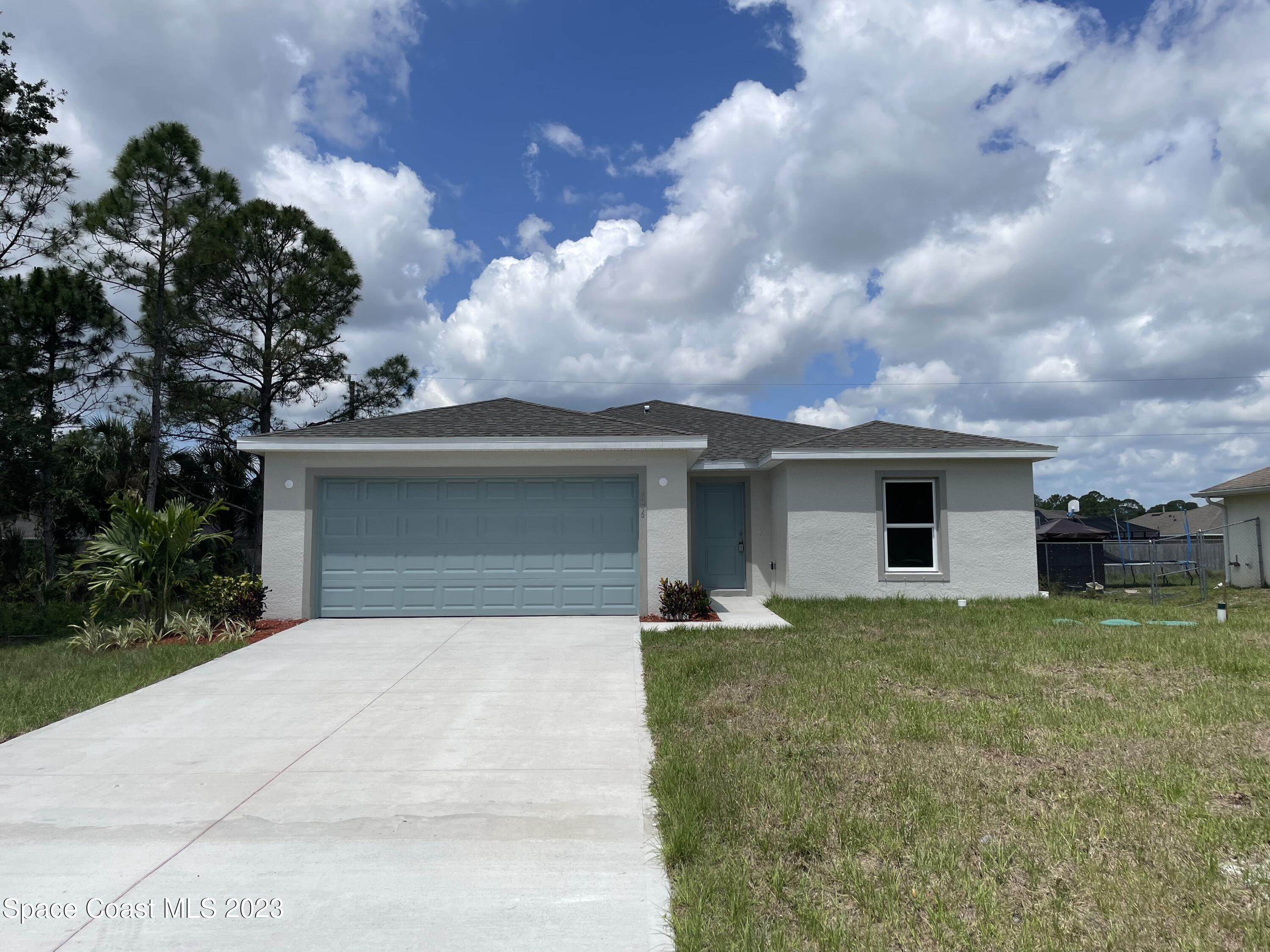 a front view of a house with yard