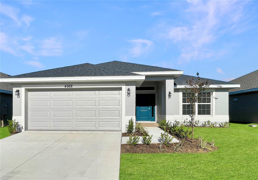 front view of a house with a yard