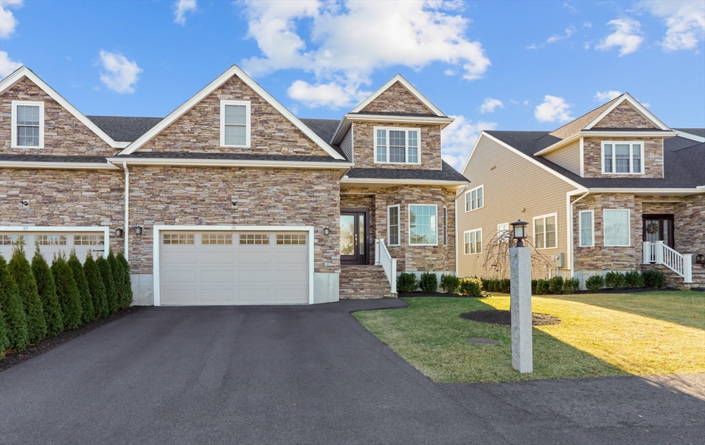 a front view of a house with a yard