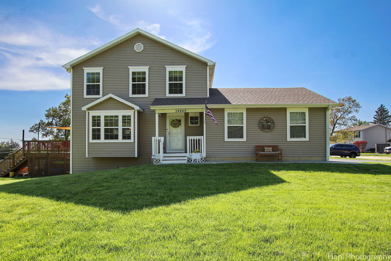 a front view of a house with a garden