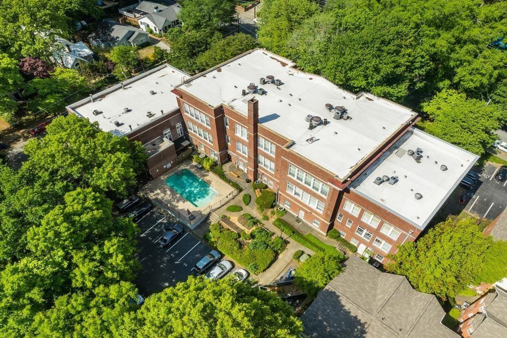 an aerial view of a house with a yard and potted plants