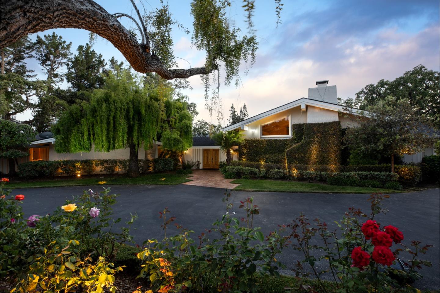 a front view of a house with garden