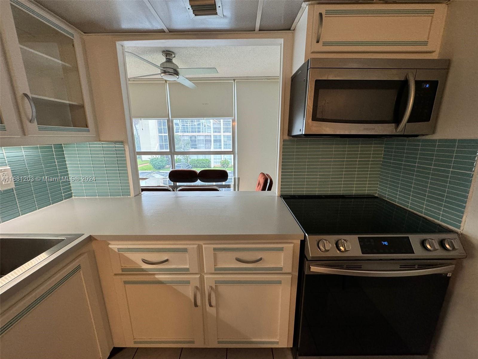 a kitchen with a stove and a microwave