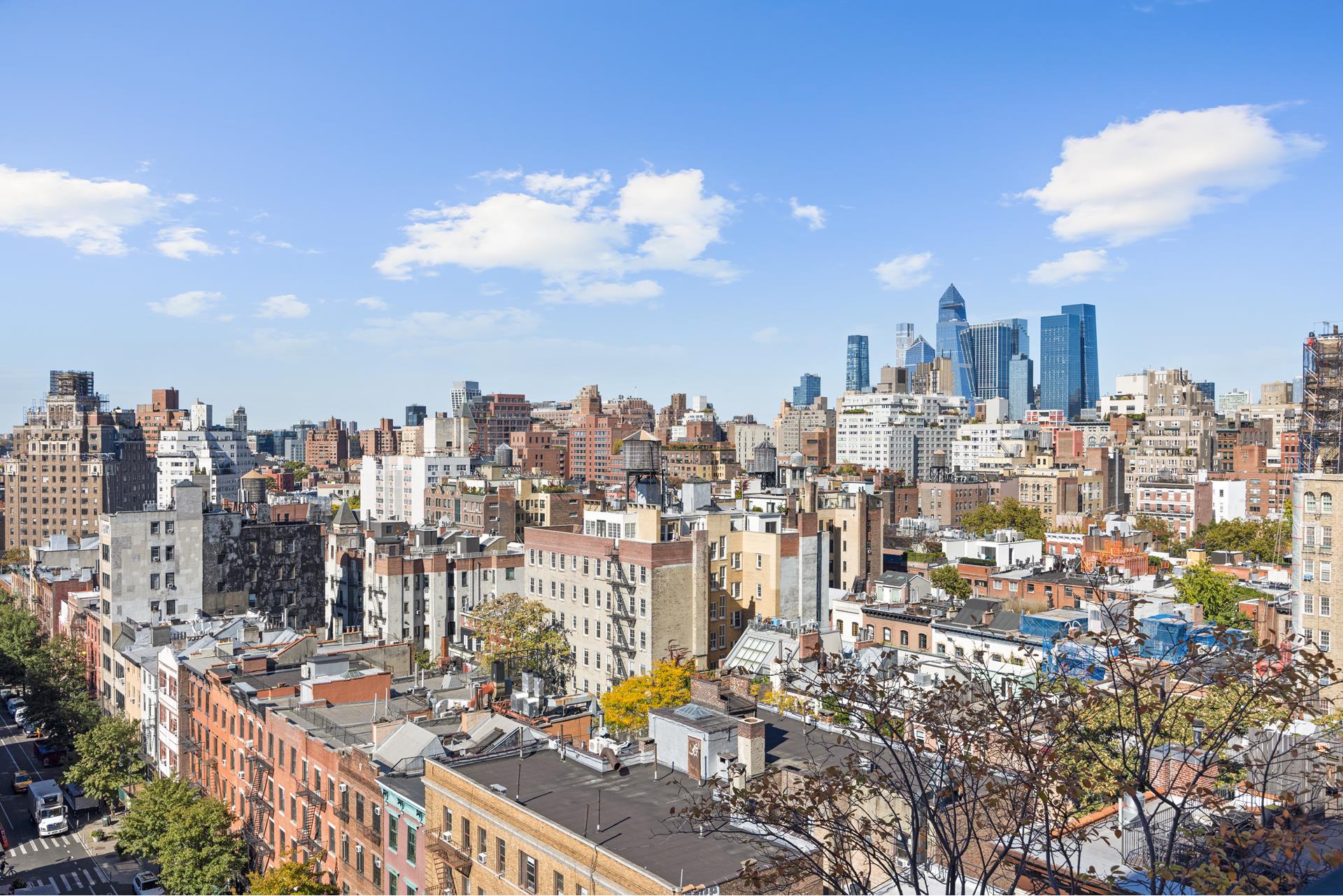 a view of a city with tall buildings