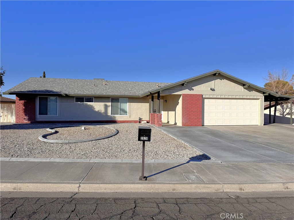 a front view of a house with garage