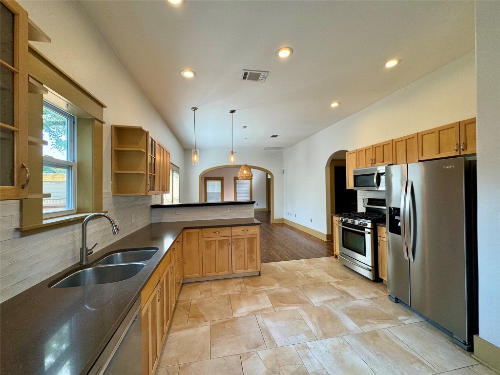 A chef's delight, hosting and mealtime with those you love is a breeze! Appreciate this layout of the spacious dining area into the kitchen.