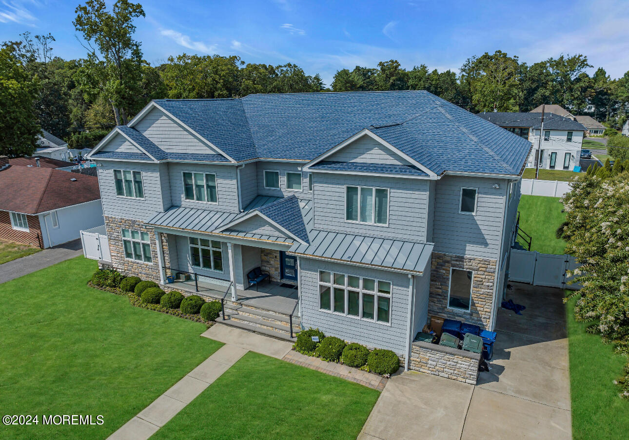 a aerial view of a house with a yard