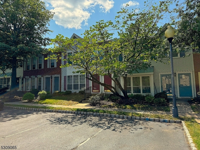 a view of a house with a yard balcony and tree s