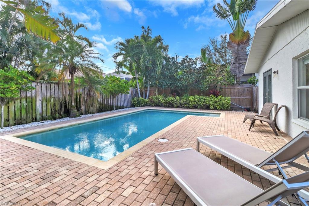 a view of a swimming pool with a patio